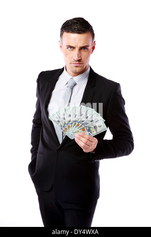 Zuversichtlich Geschäftsmann hält US-Dollar auf einem weißen Hintergrund isoliert Stockfoto
