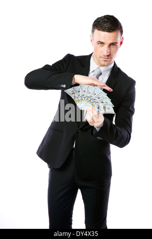 Gut aussehend Geschäftsmann hält US-Dollar auf einem weißen Hintergrund isoliert Stockfoto