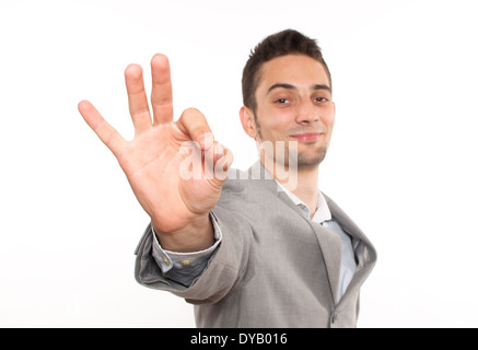 Hübscher Junge kaukasischer Geschäftsmann zeigt ok singen Stockfoto