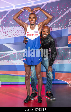 London, UK. 14. April 2014. Mo Farah stellt bei einem Fototermin auf seine zwei neuen Wachsfiguren bei Madame Tussauds in London am 14. April 2014 zu enthüllen. Einer der das Wachsfigurenkabinett erscheint in London und die andere in Blackpool. Bildnachweis: Jamie Hunt/Alamy Live-Nachrichten Stockfoto