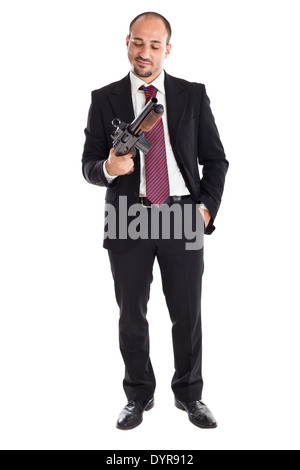 ein Geschäftsmann stehen und halten eine Schrotflinte Stockfoto