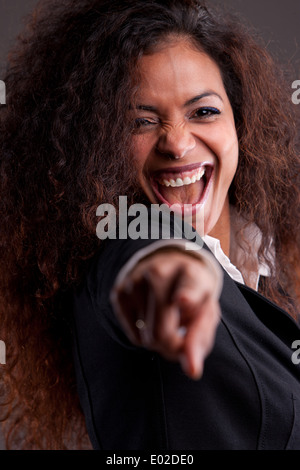 Schönen lächelnden Frau Zeigefinger Stockfoto