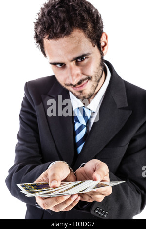 ein eleganter junger Geschäftsmann hält ein Kartenspiel Stockfoto