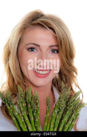 Frau mit grünem Spargel, Frau Mit Gruenem Spargel Stockfoto