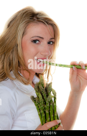Frau mit grünem Spargel, Frau Mit Gruenem Spargel Stockfoto