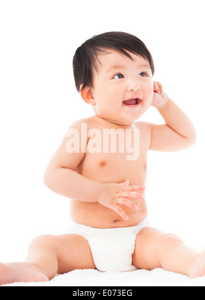 lächelndes Baby Kind Babysitting und nachschlagen Stockfoto