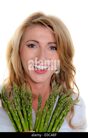 Frau mit grünem Spargel. Vor weißem Hintergrund, Frau Mit Gruenem Spargel. Vor Weissem Hintergrund Stockfoto