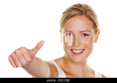 Eine junge, erfolgreiche Frau hält die Daumen nach oben. Symbolisches Bild für Erfolg, befreit mehr zu Hintergrund, Eine weiße Stockfoto