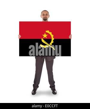 Geschäftsmann hält eine große Karte Fahne Angola isoliert auf weiss Stockfoto