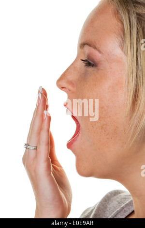 Eine junge Frau hält die Hand vor den Mund mit dem Gähnen. Müdigkeit und Mangel, Eine Junge Frau Haelt Sich schlafen Stockfoto