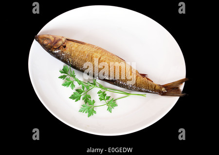 ein geräucherter Kipper auf weißen Teller Stockfoto