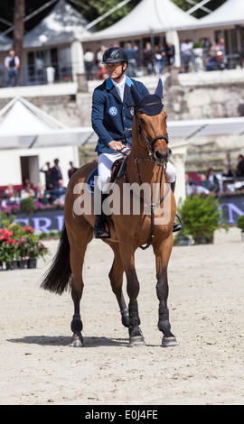 Jens Fredricson auf seinem Pferd "Lunatic" bei Furusiyya FEI Nations Cup Springturnier in Piazza di Siena in Rom 2013 Stockfoto