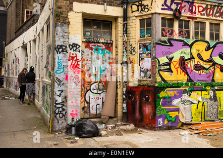 Graffiti an Wänden in der Nähe von Brick Lane, London Stockfoto