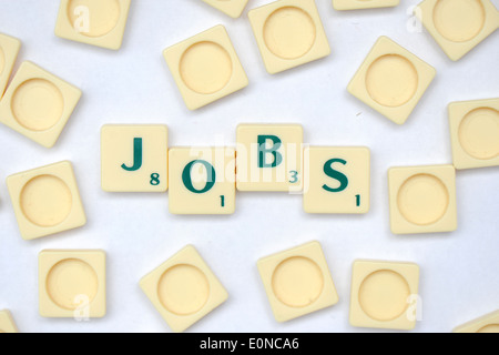 Scrabble Fliesen Auslesen die Worte-jobs Stockfoto