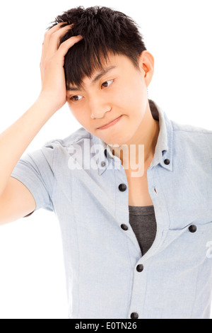 junger Mann fühlen sich verärgert und hielt seinen Kopf Stockfoto