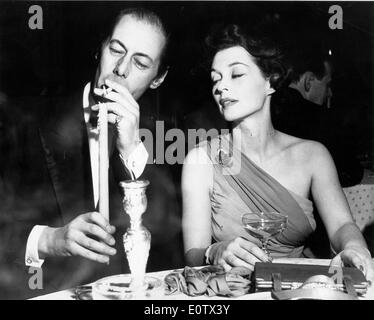 Schauspieler Rex Harrison und Lilli Palmer bei einem Abendessen Stockfoto