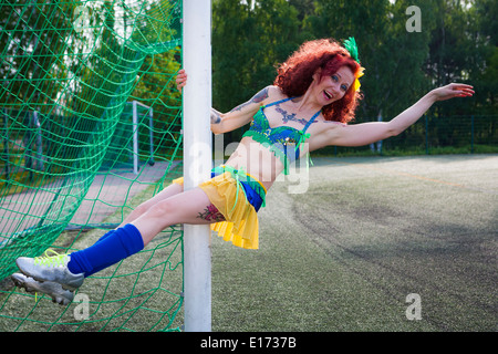 Burleske Fußball Lady Stockfoto