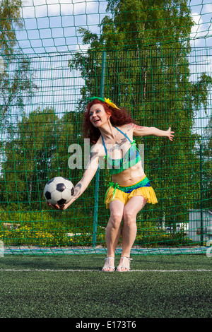 Burleske Fußball Lady Stockfoto