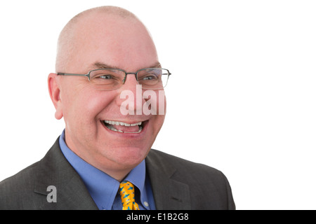 Glücklich jovialen Geschäftsmann mit Blick auf die Seite mit einem strahlenden freundlich lächeln, Kopf und Schultern Porträt auf weißen Brille Stockfoto