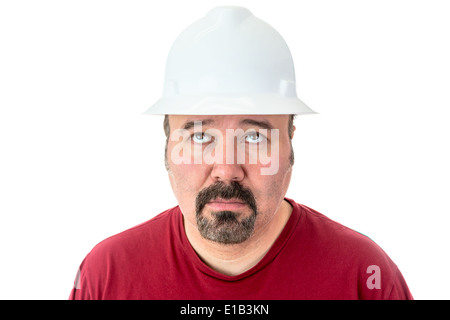Glum suchen Arbeiter trägt einen Bauarbeiterhelm auf der Suche nach Inspiration heben seine Augen zum Himmel flehend, isoliert am Pfingstmontag Stockfoto