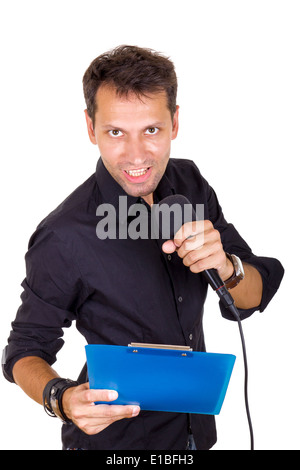 ehrgeizigen jungen männlichen Führer spricht über Mikrofon mit Noten Stockfoto