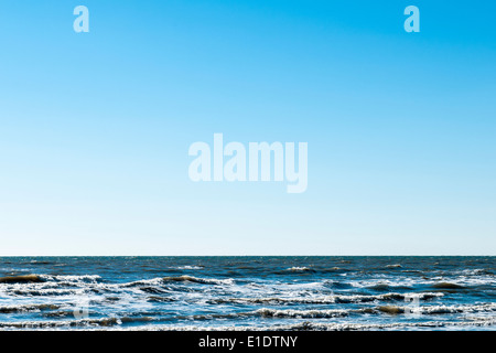 Surf und Himmel in Galveston, Tx Stockfoto