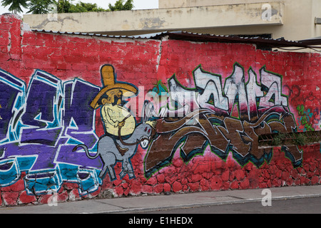 Urbane Kunst Darstellung eine Fette mexikanische Mann reitet ein Esel oder Packesel in die spanische Kolonialstadt von Santiago de Querétaro, Mexiko Stockfoto