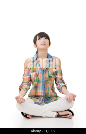 Asiatische Frau in Yoga-pose Stockfoto