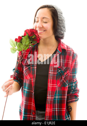 Junge Frau duftende rose Stockfoto