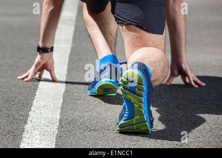 Läufer in Startposition. Stockfoto