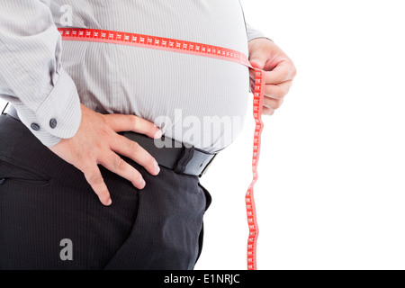 Fett Geschäftsmann Skala verwenden, um seine Taille messen Stockfoto