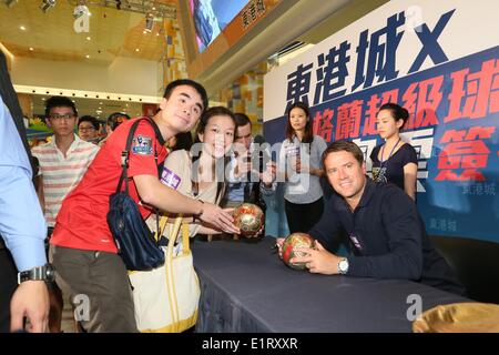 Hong Kong, China. 8. Juni 2014. Michael James Owen betreut gewerbliche Tätigkeit in Hong Kong, China auf Sonntag, 8. Juni 2014. © TopPhoto/Alamy Live-Nachrichten Stockfoto