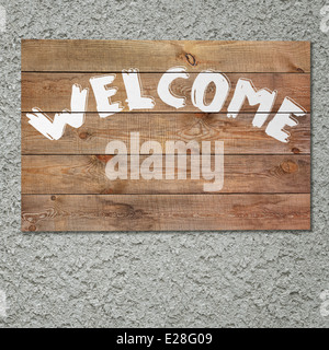 Vintage "welcome" aus Holz Schild an Stuck graue Betonwand. Stockfoto