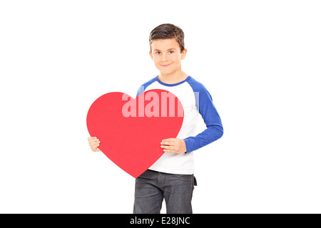 Junge hält ein großes rotes Herz Stockfoto