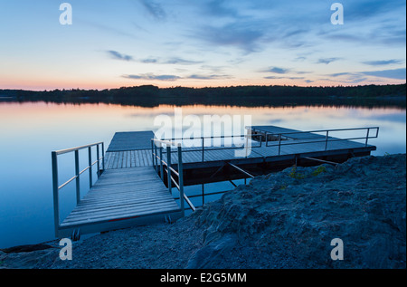 Die untergehende Sonne über ein Dock an der Georgian Bay. Die Massasauga Provincial Park, Ontario, Kanada. Stockfoto