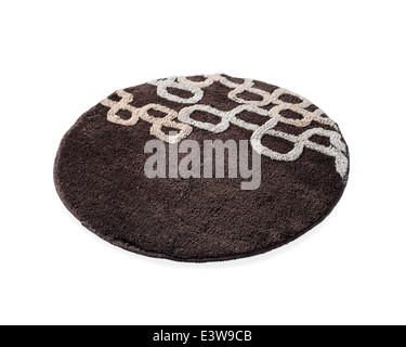 eine Runde braunen Teppich isoliert auf weißem Hintergrund Stockfoto