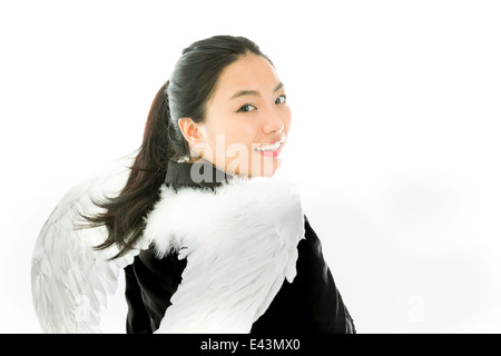 Attraktive asiatische junge Frau Engel und Dämon Stockfoto