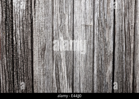 eine verwitterte Holzoberfläche mit viel Charakter Stockfoto