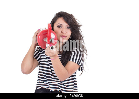 Latin Girl Holding Feuerlöscher Stockfoto