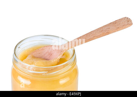 Honig im Glas mit einem Holzlöffel. Stockfoto