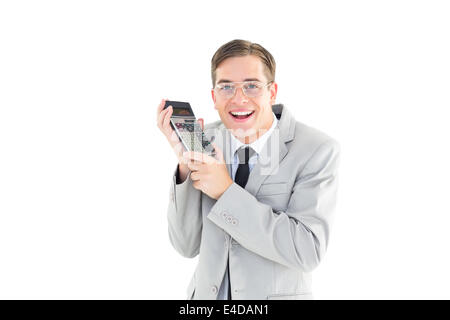 Geeky lächelnd Geschäftsmann Betrieb Taschenrechner Stockfoto