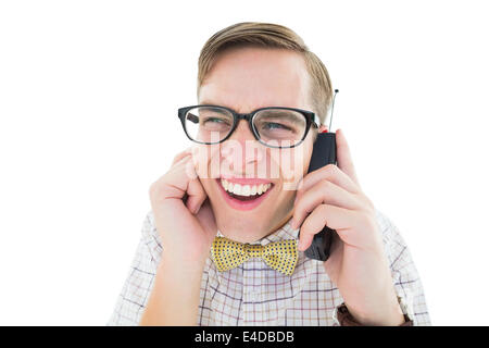 Geeky Hipster hält ein Retro-Handy Stockfoto