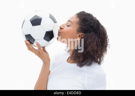 Hübsches Mädchen küssen ihr Fußball Stockfoto