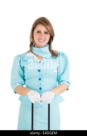 Schöne Stewardess in blauer Uniform gekleidet Stockfoto