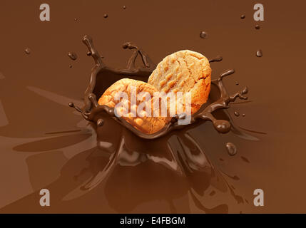 Zwei Cookies Kekse in flüssige Schokolade Spritzen fallen. Nahaufnahme. Stockfoto