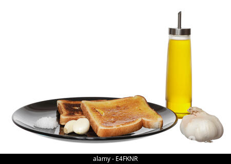 Mittelmeer-Diät Frühstück mit Toast, Brot, Knoblauch, Salz und Olivenöl. Stockfoto