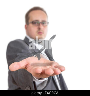 Business-Mann streckt seinen Arm mit einem Flugzeug-Symbol über der Hand schweben. Isolated on White Background Stockfoto