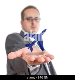 Business-Mann streckt seinen Arm mit einem Flugzeug-Symbol über der Hand schweben. Isolated on White Background Stockfoto