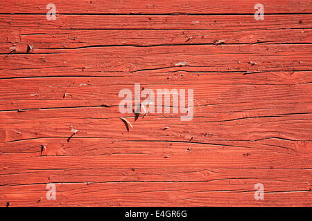Alte Holzdielen mit einem Rost rot braun abblätternde Farbe waschen Hintergrund Stockfoto