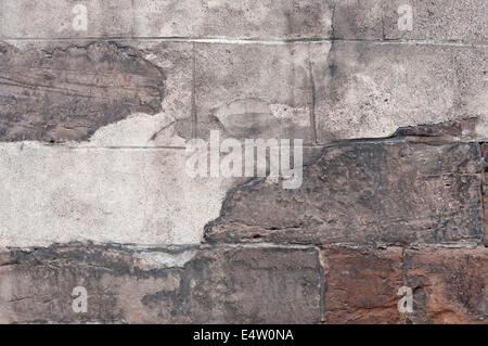 Alte Steinmauer mit peeling Putz. Stockfoto